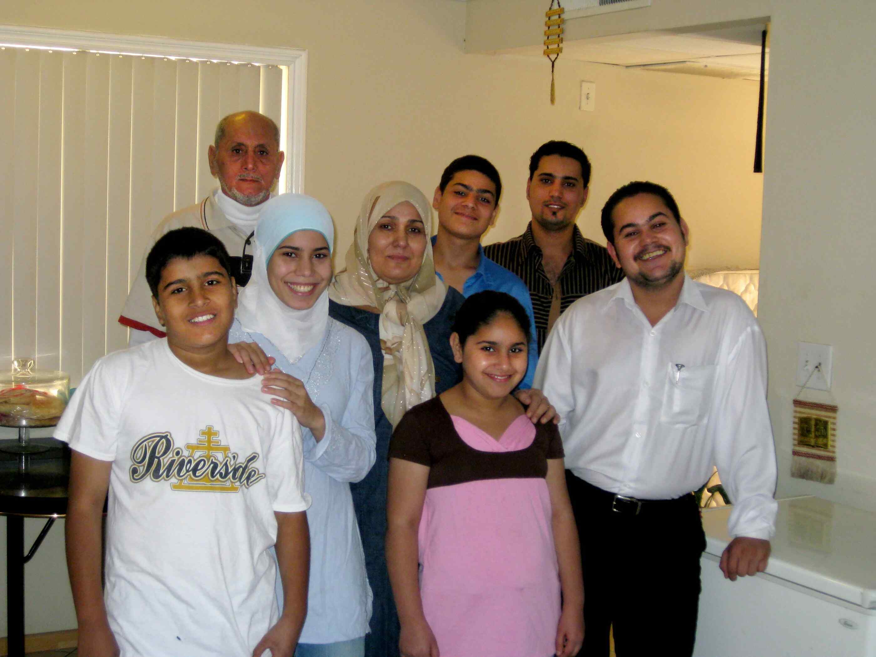 A family posing for a family portrait.